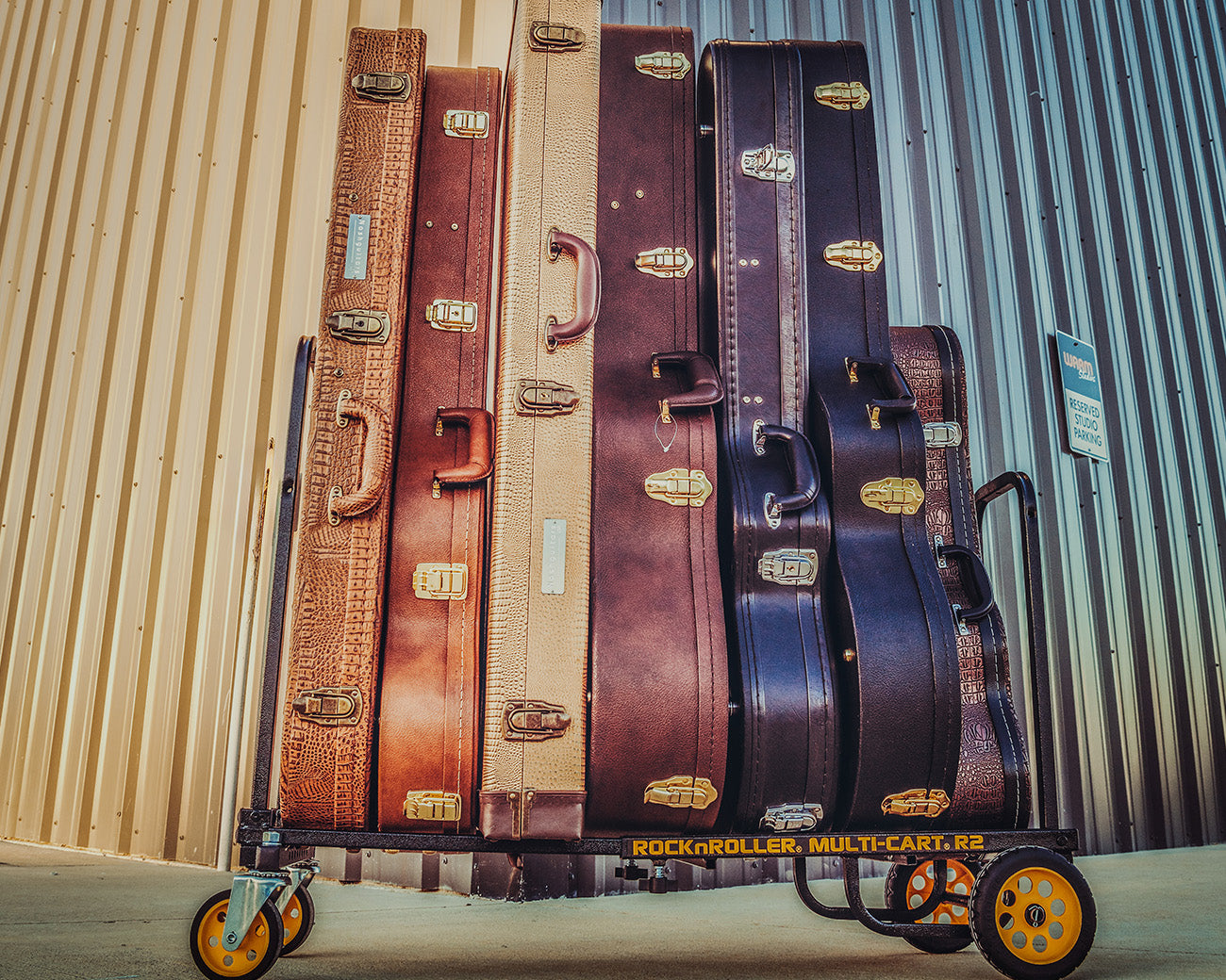 A lifestyle shot of RockNRoller® Multi-Cart® R2RT "Micro" carrying multiple musical instruments